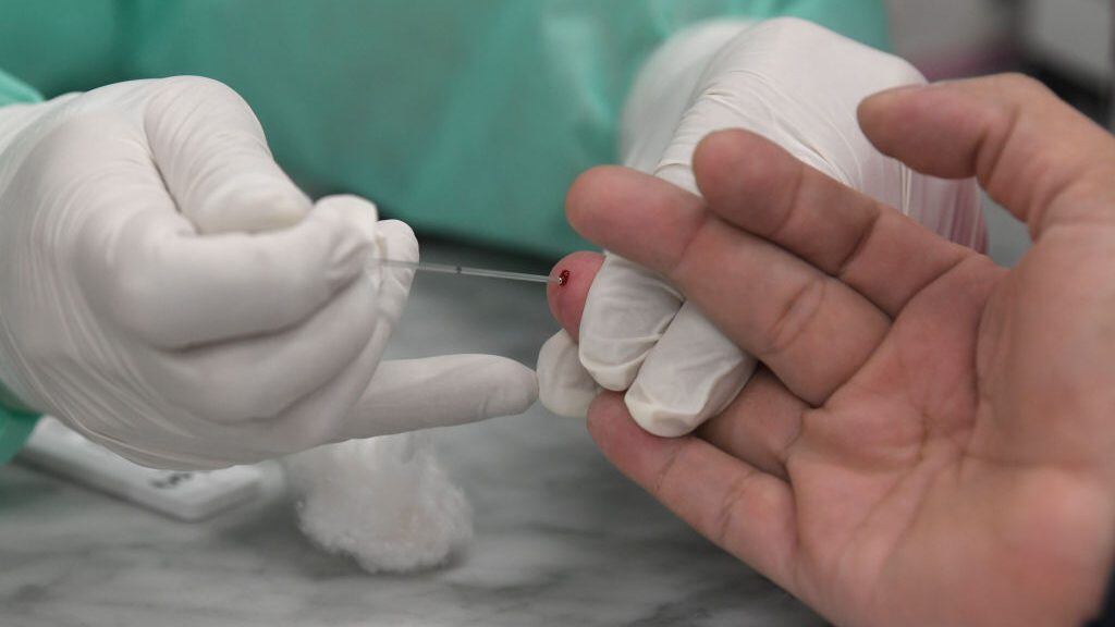 BUENOS AIRES, ARGENTINA - APRIL 24: Detail as a health worker extracts a blood sample of a commuter during the first day of serological testings for COVID-19 at Plaza Constitucion train station on April 24, 2020 in Buenos Aires, Argentina. Argentine Ministry of Health is launching massive serological testings to calculate the circulation of the COVID-19 in the population at the main train stations of Buenos Aires. (Photo by Gustavo Garello/Jam Media/Getty Images)