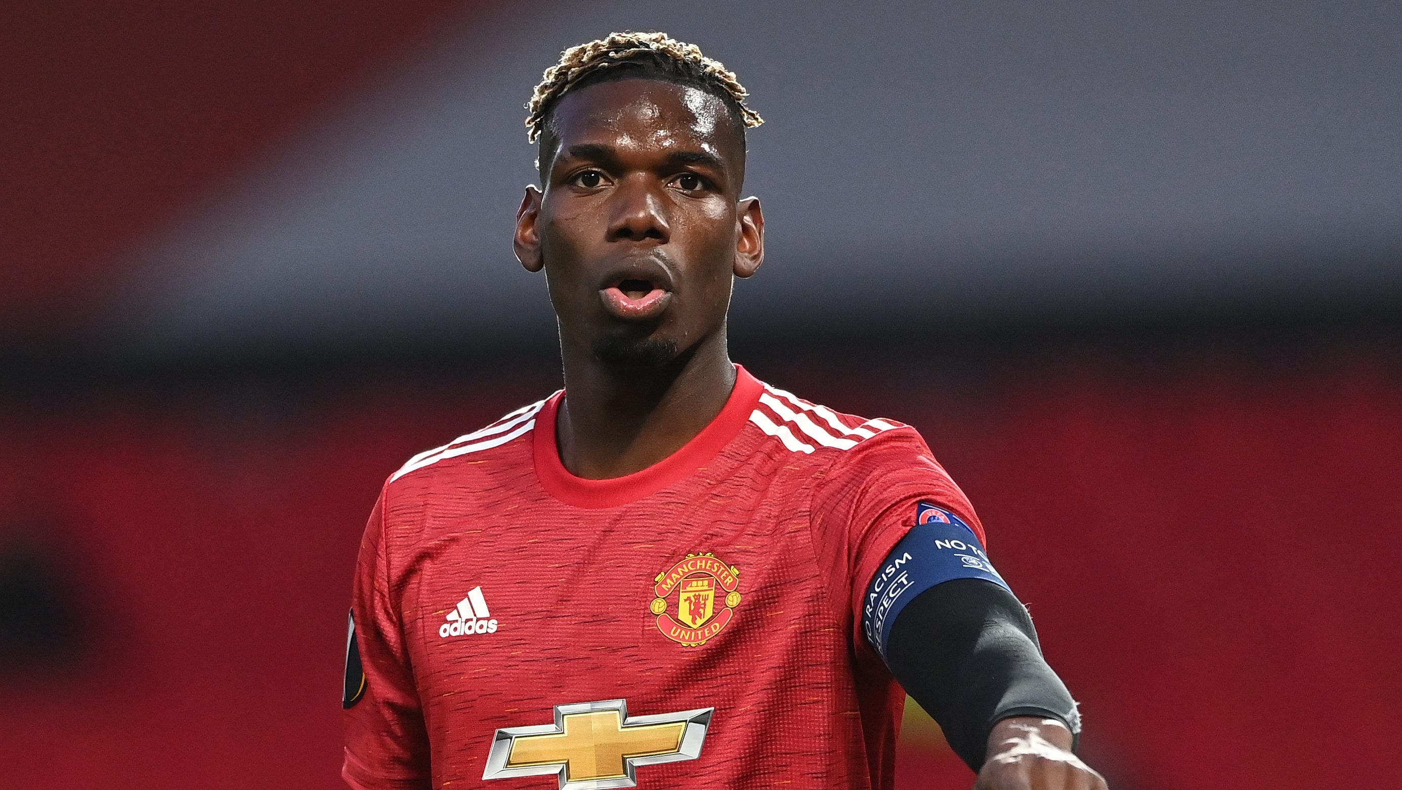 MANCHESTER, ENGLAND - APRIL 15: Paul Pogba of Manchester United makes a point during the UEFA Europa League Quarter Final Second Leg match between Manchester United and Granada CF at Old Trafford on April 15, 2021 in Manchester, England. Sporting stadiums around Europe remain under strict restrictions due to the Coronavirus Pandemic as Government social distancing laws prohibit fans inside venues resulting in games being played behind closed doors. (Photo by Stu Forster/Getty Images)