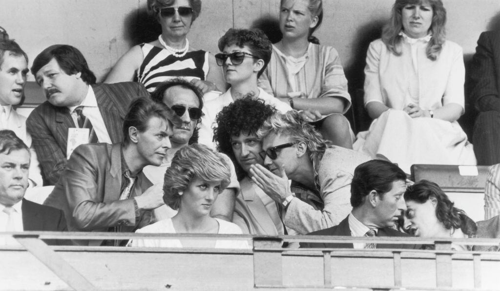 Bob Geldof has a word with Prince Charles, while David Bowie chats with Roger Taylor and Brian May of Queen, during the Live Aid Concert at Wembley Stadium, 13th July 1985. (Photo by Dave Hogan/Hulton Archive/Getty Images)
