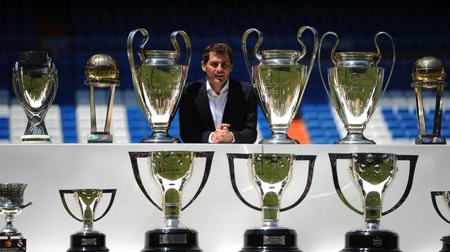 MADRID, SPAIN - JULY 13: Iker Casillas poses behind trophies he has won during his career in Real Madrid after holding a press conference with Real president Florentino Perez at the Santiago Bernabeu stadium to announce that he will be leaving Real Madrid football team on July 13, 2015 in Madrid, Spain. (Photo by Denis Doyle/Getty Images)