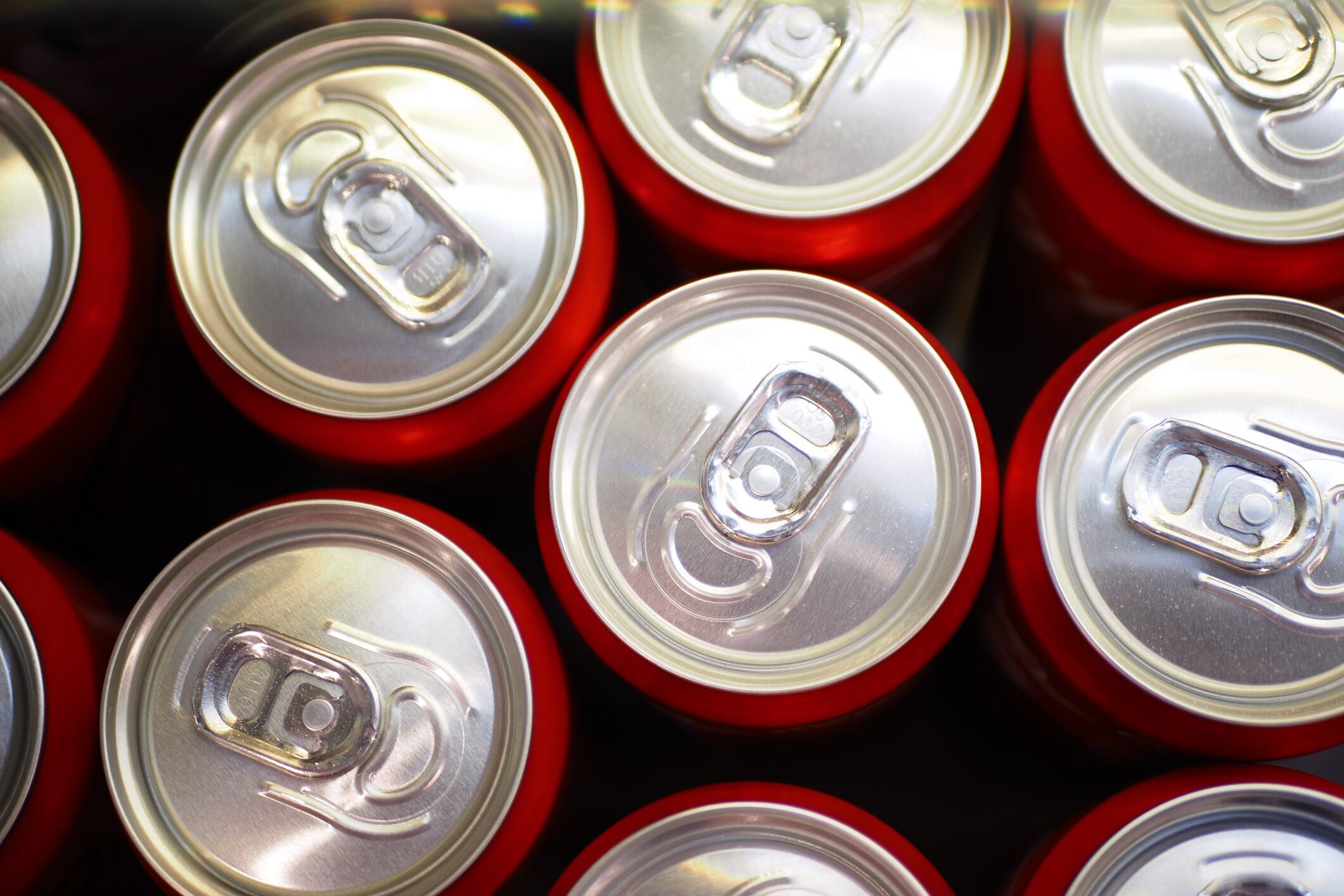 Cans of soft drink lined up