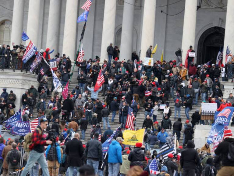 WASHINGTON, DC - JANUARY 06: Protesters gather on the U.S. Capitol Building on January 06, 2021 in Washington, DC. Pro-Trump protesters entered the U.S. Capitol building after mass demonstrations in the nation's capital during a joint session Congress to ratify President-elect Joe Biden's 306-232 Electoral College win over President Donald Trump. (Photo by Tasos Katopodis/Getty Images)