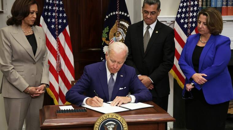 WASHINGTON, DC - JULY 08: U.S. President Joe Biden signs an executive order on access to reproductive health care services as (L-R) Vice President Kamala Harris, Secretary of Health and Human Services Xavier Becerra, and Deputy Attorney General Lisa Monaco look on during an event at the Roosevelt Room of the White House on July 8, 2022 in Washington, DC. President Biden delivered remarks on reproductive rights at the event. (Photo by Alex Wong/Getty Images)