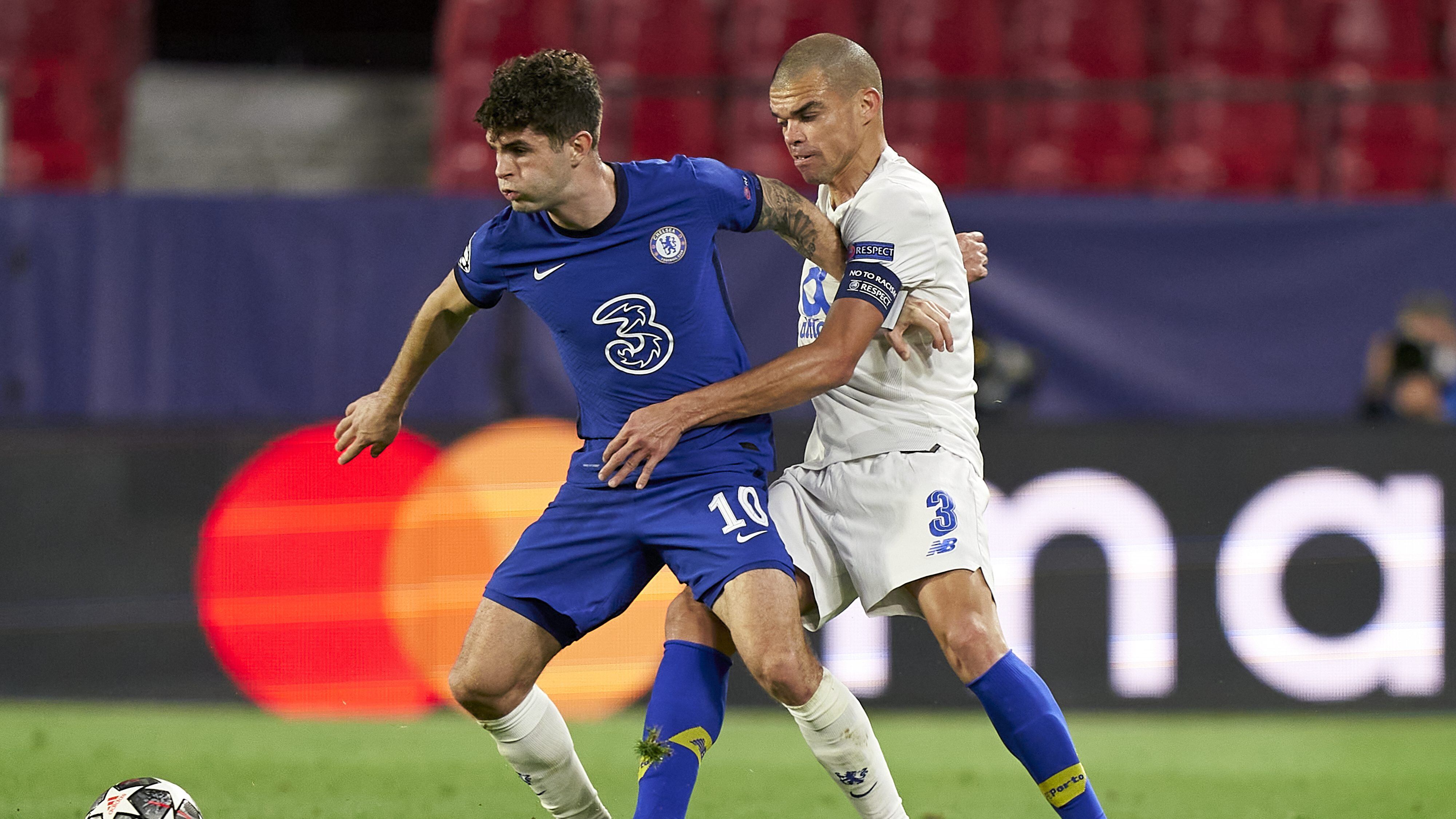 SEVILLE, SPAIN - APRIL 13: Christian Pulisic of Chelsea FC competes for the ball with Kepler Lima 'Pepe' of Porto during the UEFA Champions League Quarter Final Second Leg match between Chelsea FC and FC Porto at Estadio Ramon Sanchez Pizjuan on April 13, 2021 in Seville, Spain. Sporting stadiums around Spain remain under strict restrictions due to the Coronavirus Pandemic as Government social distancing laws prohibit fans inside venues resulting in games being played behind closed doors.  (Photo by Jose Manuel Alvarez/Quality Sport Images/Getty Images)