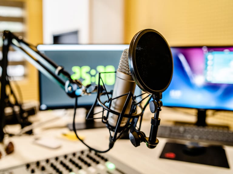 Microphone and mixer at the radio station studio broadcasting news