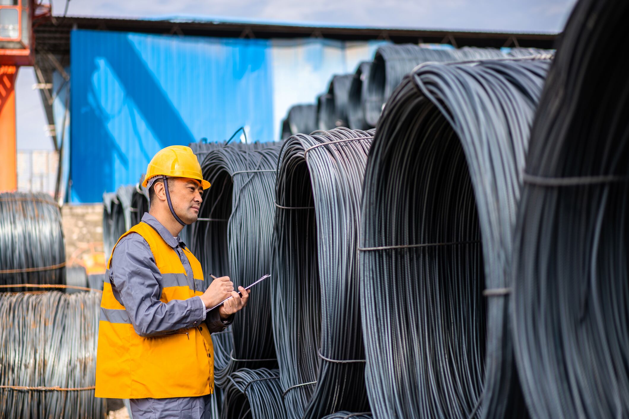 Asian worker working in the steel market