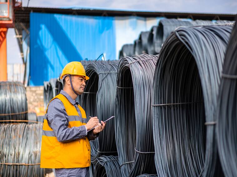 Asian worker working in the steel market