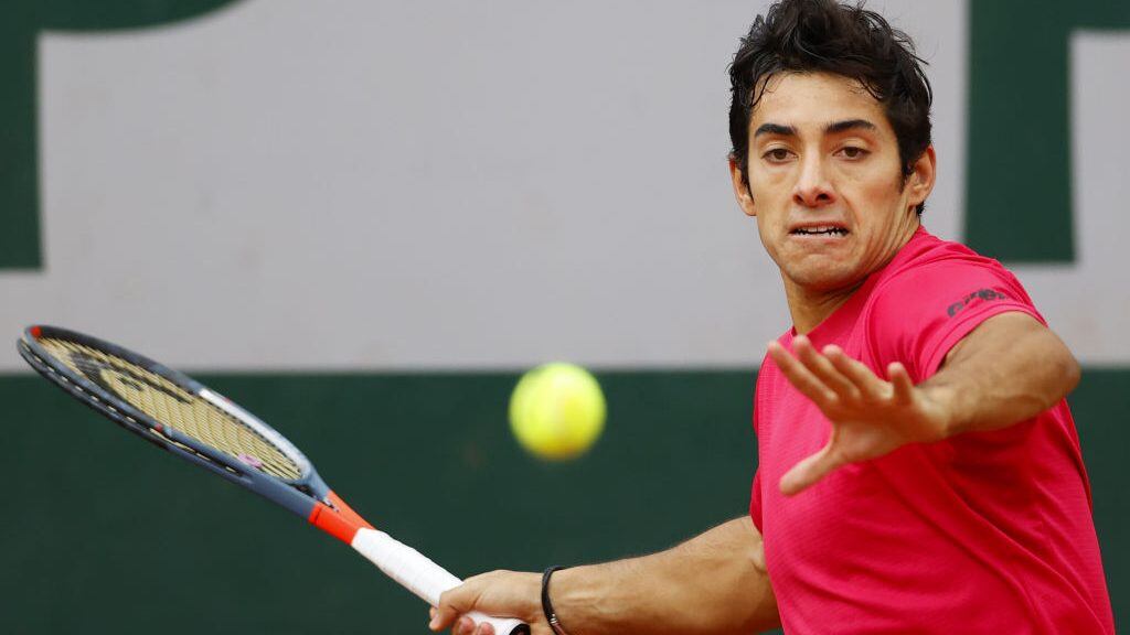 Chile's Christian Garin returns the ball to Russia's Karen Khachanov during their men's singles third round tennis match on Day 7 of The Roland Garros 2020 French Open tennis tournament in Paris on October 3, 2020. (Photo by Thomas SAMSON / AFP) (Photo by THOMAS SAMSON/AFP via Getty Images)