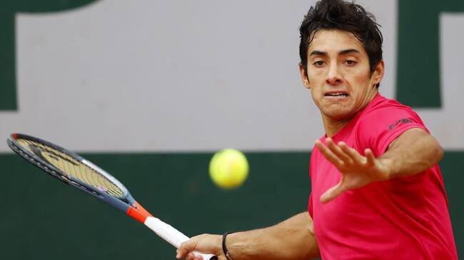 Chile's Christian Garin returns the ball to Russia's Karen Khachanov during their men's singles third round tennis match on Day 7 of The Roland Garros 2020 French Open tennis tournament in Paris on October 3, 2020. (Photo by Thomas SAMSON / AFP) (Photo by THOMAS SAMSON/AFP via Getty Images)
