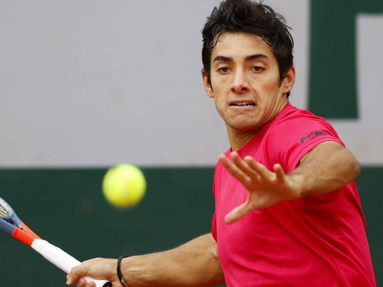Chile's Christian Garin returns the ball to Russia's Karen Khachanov during their men's singles third round tennis match on Day 7 of The Roland Garros 2020 French Open tennis tournament in Paris on October 3, 2020. (Photo by Thomas SAMSON / AFP) (Photo by THOMAS SAMSON/AFP via Getty Images)