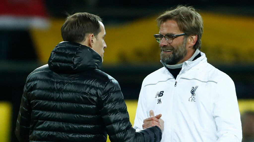 Dortmund's head coach Thomas Tuchel (L) and Liverpool's German head coach Jurgen Klopp shake hands after the UEFA Europe League quarter-final, first-leg football match Borussia Dortmund vs Liverpool FC in Dortmund, western Germany on April 7, 2016.The match ended with a 1-1 draw. / AFP / ODD ANDERSEN (Photo credit should read ODD ANDERSEN/AFP via Getty Images)