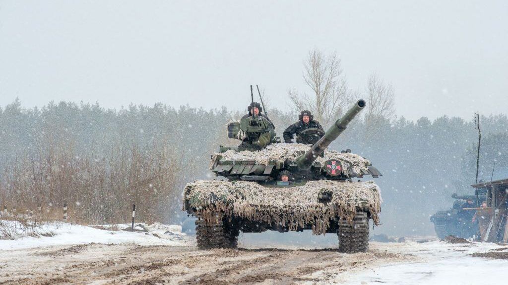 TOPSHOT - Ukrainian Military Forces servicemen of the 92nd mechanized brigade use tanks, self-propelled guns and other armored vehicles to conduct live-fire exercises near the town of Chuguev, in Kharkiv region, on February 10, 2022. - Russia's deployment for a military exercise in Belarus and on the borders of Ukraine marks a "dangerous moment" for European security, NATO's chief said on February 10, 2022. (Photo by Sergey BOBOK / AFP) (Photo by SERGEY BOBOK/AFP via Getty Images)