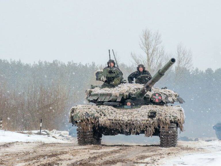 TOPSHOT - Ukrainian Military Forces servicemen of the 92nd mechanized brigade use tanks, self-propelled guns and other armored vehicles to conduct live-fire exercises near the town of Chuguev, in Kharkiv region, on February 10, 2022. - Russia's deployment for a military exercise in Belarus and on the borders of Ukraine marks a "dangerous moment" for European security, NATO's chief said on February 10, 2022. (Photo by Sergey BOBOK / AFP) (Photo by SERGEY BOBOK/AFP via Getty Images)