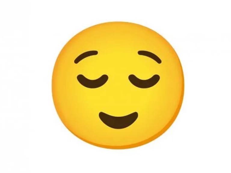 Emoji de cara de alivio en WhatsApp