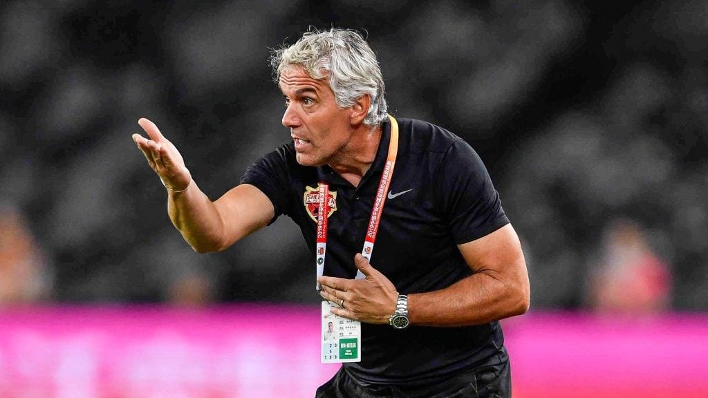 This photo taken on October 26, 2019 shows Shenzhen FC head coach Roberto Donadoni gesturing during the Chinese Super League (CSL) football match between Shenzhen FC and Wuhan Zall FC in Shenzhen in China's southern Guangdong province. - Roberto Donadoni would rather focus on his coaching job in China but instead the AC Milan legend's thoughts are consumed by the suffering coronavirus has brought to his hometown in northern Italy. (Photo by STR / AFP) / China OUT / TO GO WITH FBL-ASIA-CHN-DONADONI-ITA-HEALTH-VIRUS-ITALY BY PETER STEBBINGS (Photo by STR/AFP via Getty Images)