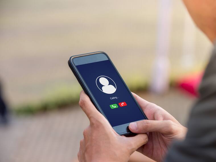 Voice call concept on the screen. Man holding smartphone doing voice call to someone.