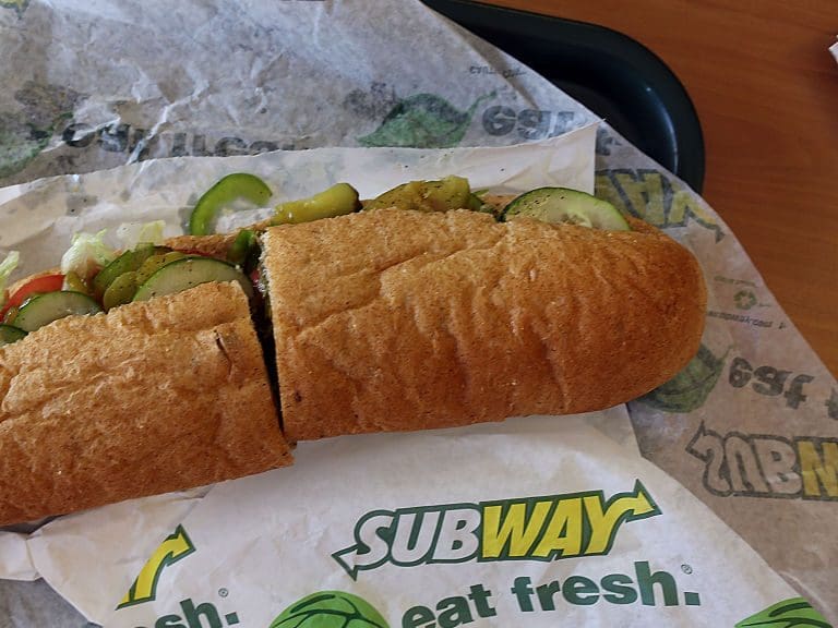 MIAMI, FL - OCTOBER 21:  A Subway sandwich is seen in a restaurant as the company announced a settlement over a class-action lawsuit that alleged that Subway engaged in deceptive marketing for its 6-inch and 12-inch sandwiches and served customers less food than they were paying for on October 21, 2015 in Miami, Florida. While it denies the claims, Subway said that franchisees would be required to have a measurement tool in stores to make sure loaves are 12-inches.  (Photo by Joe Raedle/Getty Images)