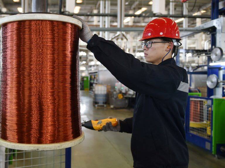 NANJING, CHINA - JANUARY 18: An employee produces copper wires at Nanjing Gree Electric Enterprise Co., Ltd. on January 18, 2021 in Nanjing, Jiangsu Province of China. (Photo by Fang Dongxu/VCG via Getty Images)