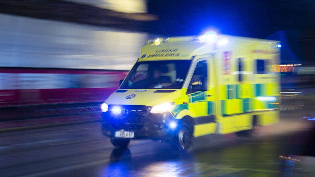 LONDON, UNITED KINGDOM - JANUARY 13: An ambulance carrying patients is seen as UK records 109,133 new Covid-19 cases and 335 death in the past 24 hours on January 13, 2022, in London, United Kingdom. (Photo by Rasid Necati Aslim/Anadolu Agency via Getty Images)