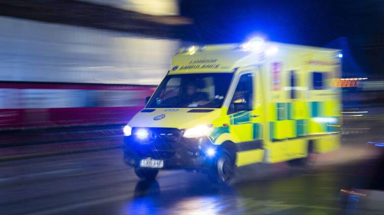 LONDON, UNITED KINGDOM - JANUARY 13: An ambulance carrying patients is seen as UK records 109,133 new Covid-19 cases and 335 death in the past 24 hours on January 13, 2022, in London, United Kingdom. (Photo by Rasid Necati Aslim/Anadolu Agency via Getty Images)