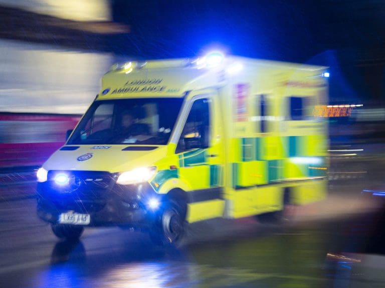 LONDON, UNITED KINGDOM - JANUARY 13: An ambulance carrying patients is seen as UK records 109,133 new Covid-19 cases and 335 death in the past 24 hours on January 13, 2022, in London, United Kingdom. (Photo by Rasid Necati Aslim/Anadolu Agency via Getty Images)