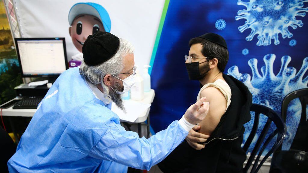 BNEI BRAK, ISRAEL - FEBRUARY 17: An Ultra-Orthodox Jewish receives a dose of the Pfizer-BioNtech coronavirus (COVID-19) vaccine, in the Israeli city of Bnei Brak, a home to many ultra-Orthodox Jewish residents, near Tel Aviv on February 17, 2021. (Photo by Mostafa Alkharouf/Anadolu Agency via Getty Images)