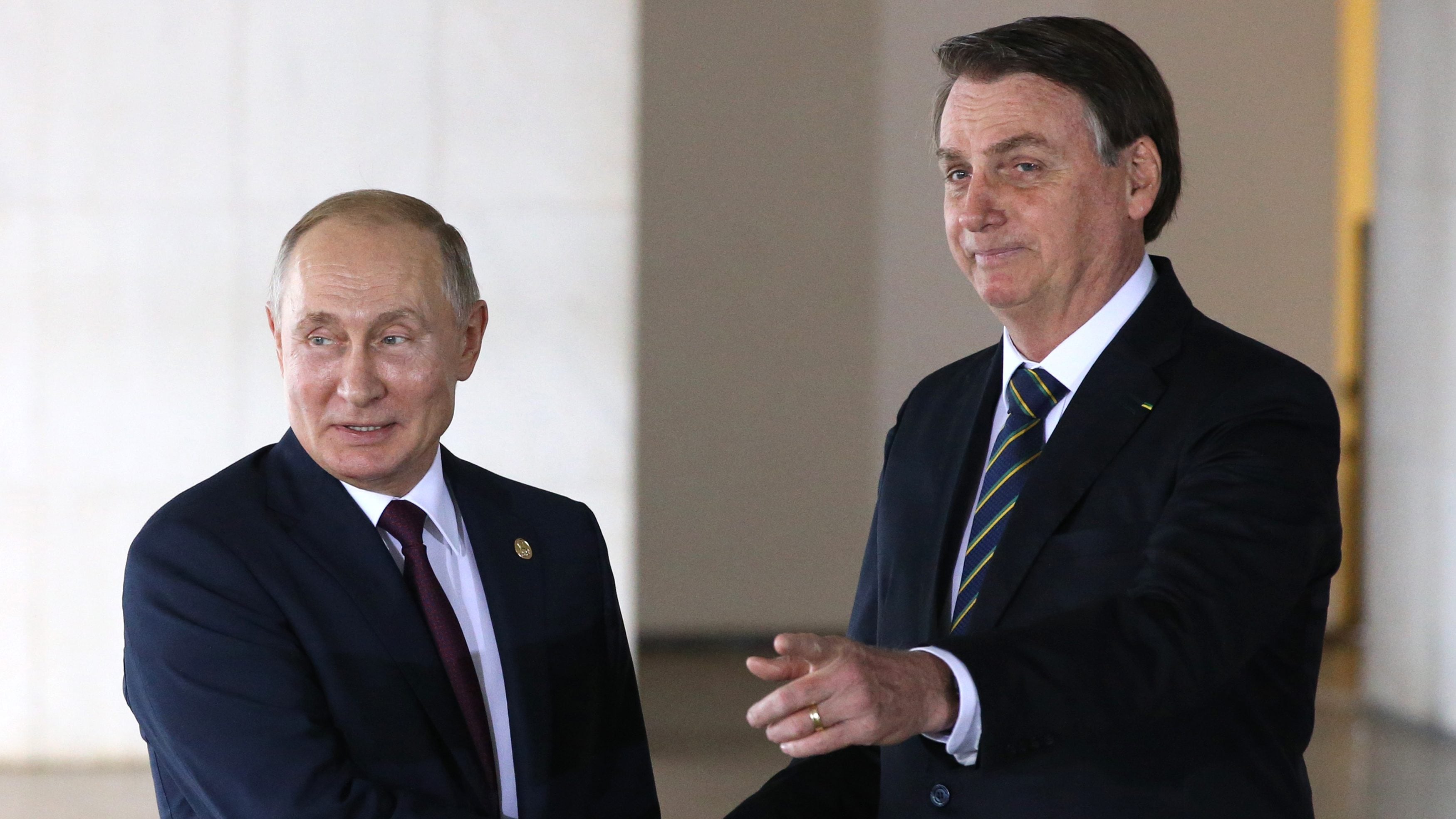 BRASILIA, BRAZIL - NOVEMBER 14: (RUSSIA OUT)  Russian President Vladimir Putin (L) greets Brazilian President Jair Bolsonaro (R) during a welcoming ceremony on November 13, 2019 in Brasilia, Brazil. Leaders of Russia, China, Brazil, India and South Africa have gathered in Brasila for the BRICS Leaders Summit. (Photo by Mikhail Svetlov/Getty Images)