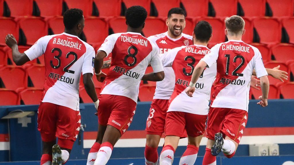 Monaco's players celebrate after Monaco's Chilean defender Guillermo Maripan (C) scored the team's second goal, during the French L1 football match between Paris-Saint Germain (PSG) and AS Monaco FC at The Parc des Princes Stadium in Paris on February 21, 2021. (Photo by FRANCK FIFE / AFP) (Photo by FRANCK FIFE/AFP via Getty Images)