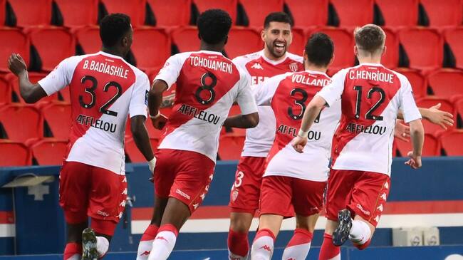 Monaco's players celebrate after Monaco's Chilean defender Guillermo Maripan (C) scored the team's second goal, during the French L1 football match between Paris-Saint Germain (PSG) and AS Monaco FC at The Parc des Princes Stadium in Paris on February 21, 2021. (Photo by FRANCK FIFE / AFP) (Photo by FRANCK FIFE/AFP via Getty Images)