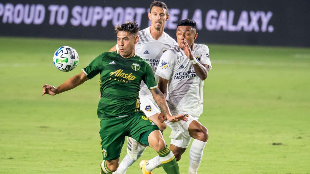 CARSON, CA - OCTOBER 7:  Felipe Mora #9 of Portland Timbers controls the ball as Julian Araujo #22 of Los Angeles Galaxy defends at the Dignity Health Sports Park on October 7, 2020 in Carson, California.  Portland Timbers won the match 6-3  (Photo by Shaun Clark/Getty Images)