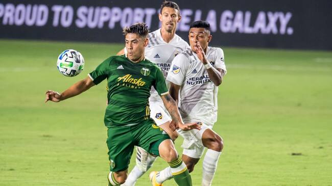 CARSON, CA - OCTOBER 7: Felipe Mora #9 of Portland Timbers controls the ball as Julian Araujo #22 of Los Angeles Galaxy defends at the Dignity Health Sports Park on October 7, 2020 in Carson, California. Portland Timbers won the match 6-3 (Photo by Shaun Clark/Getty Images)