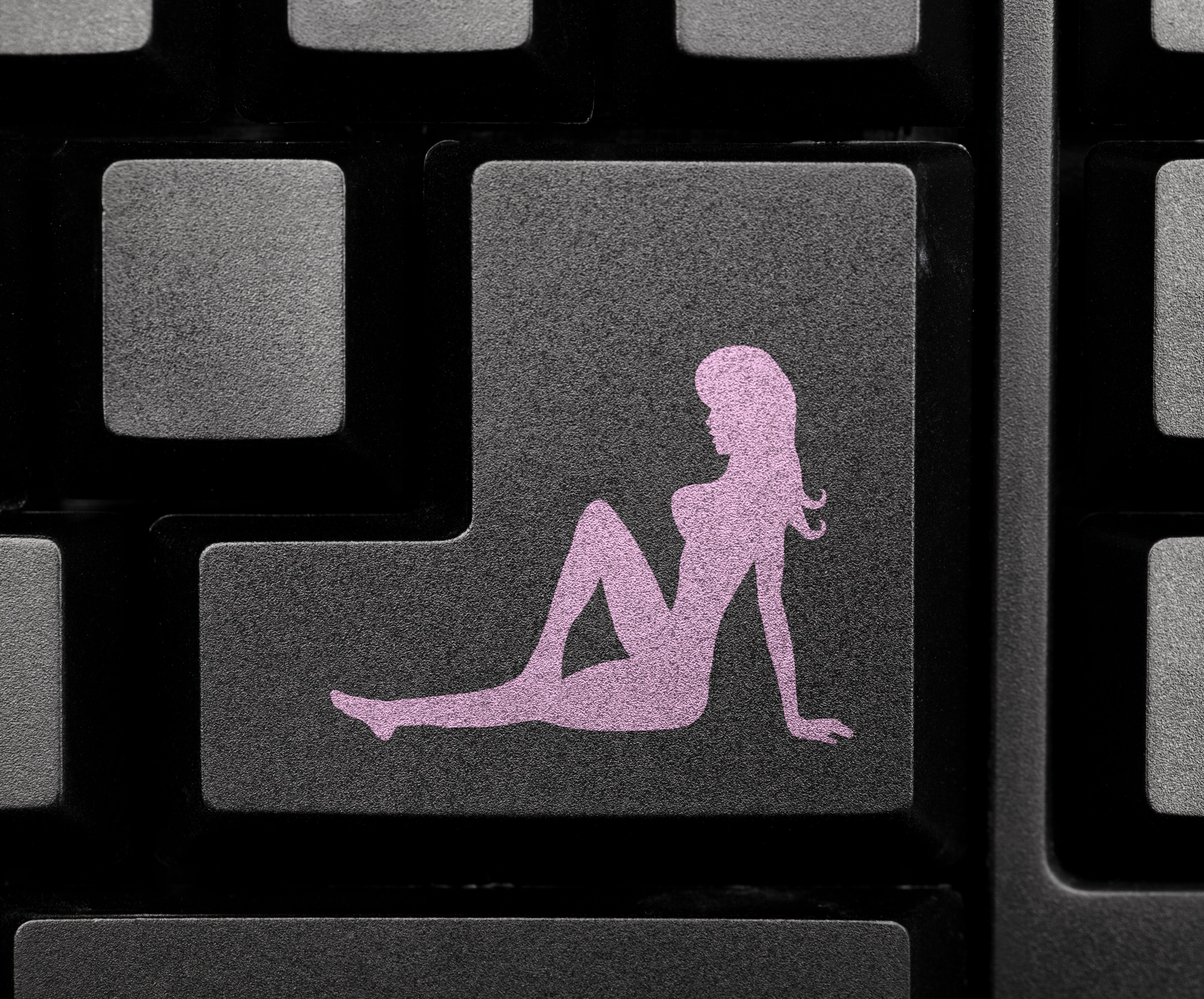Nude girl icon on computer keyboard