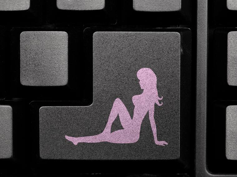Nude girl icon on computer keyboard