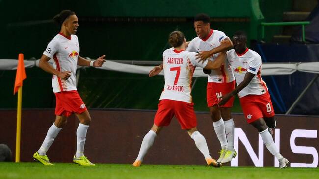 LISBON, PORTUGAL - AUGUST 13: Tyler Adams of RB Leipzig celebrates with teammates after scoring his team's second goal during the UEFA Champions League Quarter Final match between RB Leipzig and Club Atletico de Madrid at Estadio Jose Alvalade on August 13, 2020 in Lisbon, Portugal. (Photo by Lluis Gene/Getty Images)