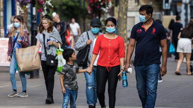 Shoppers wear face coverings to help prevent the spread of the coronavirus on 20 September 2020 in Staines-Upon-Thames, United Kingdom. The Borough of Spelthorne, of which Staines-upon-Thames forms part along with Ashford, Sunbury-upon-Thames, Stanwell, Shepperton and Laleham, has been declared an area of concern for COVID-19 by the government following a marked rise in coronavirus infections which is inconsistent with other areas of Surrey. (photo by Mark Kerrison/In Pictures via Getty Images)