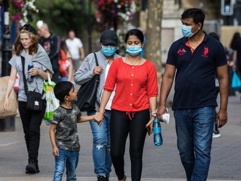 Shoppers wear face coverings to help prevent the spread of the coronavirus on 20 September 2020 in Staines-Upon-Thames, United Kingdom. The Borough of Spelthorne, of which Staines-upon-Thames forms part along with Ashford, Sunbury-upon-Thames, Stanwell, Shepperton and Laleham, has been declared an area of concern for COVID-19 by the government following a marked rise in coronavirus infections which is inconsistent with other areas of Surrey. (photo by Mark Kerrison/In Pictures via Getty Images)