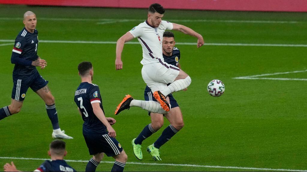 England's midfielder Declan Rice and Scotland's midfielder John McGinn vie for the ball  during the UEFA EURO 2020 Group D football match between England and Scotland at Wembley Stadium in London on June 18, 2021. (Photo by Matt Dunham / POOL / AFP) (Photo by MATT DUNHAM/POOL/AFP via Getty Images)