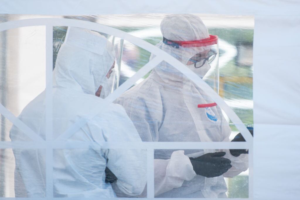 GDANSK, POLAND - APRIL 27, 2020: Medics wearing protective gears as a precaution against Covid seen during the opening of a coronavirus mobile testing center. A mobile testing point for Coronavirus was opened in Gdansk on April 27. Potential Coronavirus infected people can do the test without leaving their car.- PHOTOGRAPH BY Mateusz Slodkowski / Echoes WIre/ Barcroft Studios / Future Publishing (Photo credit should read Mateusz Slodkowski / Echoes Wire/Barcroft Media via Getty Images)