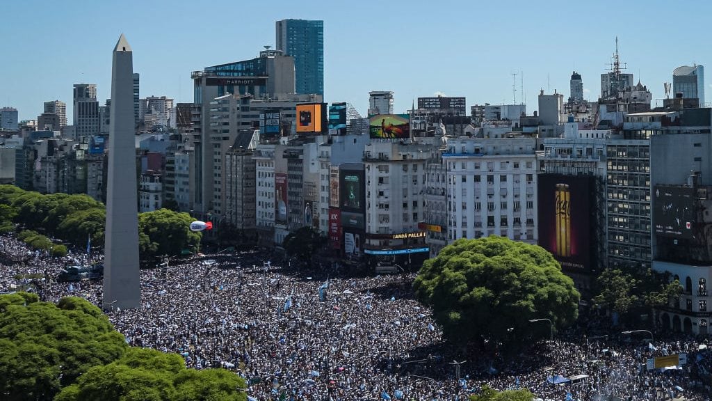 BUENOS AIRES, ARGENTINA - DECEMBER 20: Fans of Argentina gather at the Obelisk before a victory parade of the Argentina men's national football team after winning the FIFA World Cup Qatar 2022 on December 20, 2022 in Buenos Aires, Argentina. (Photo by Marcelo Endelli/Getty Images)