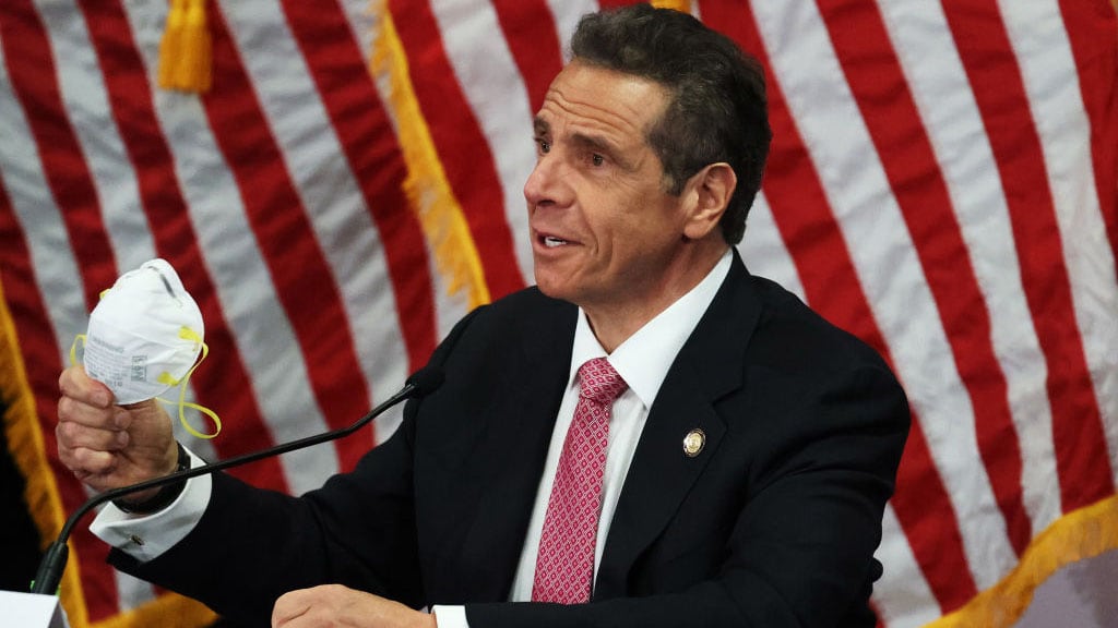 MANHASSET, NEW YORK - MAY 06: New York Governor Andrew Cuomo displays the N-95 mask he wears during a Coronavirus Briefing At Northwell Feinstein Institute For Medical Research on May 06, 2020 in Manhasset, New York. (Photo by Al Bello/Getty Images)