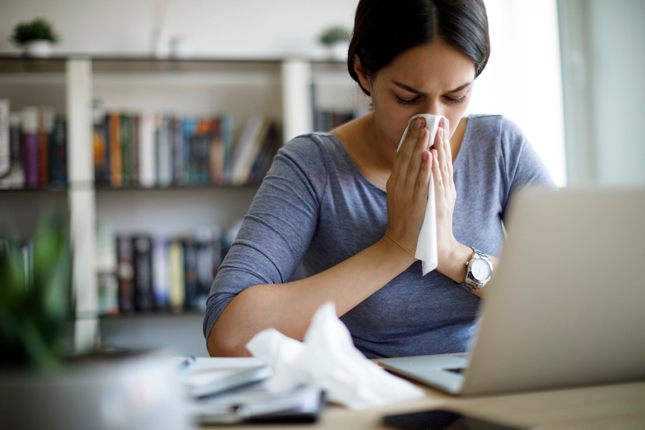 Ill woman working from home office