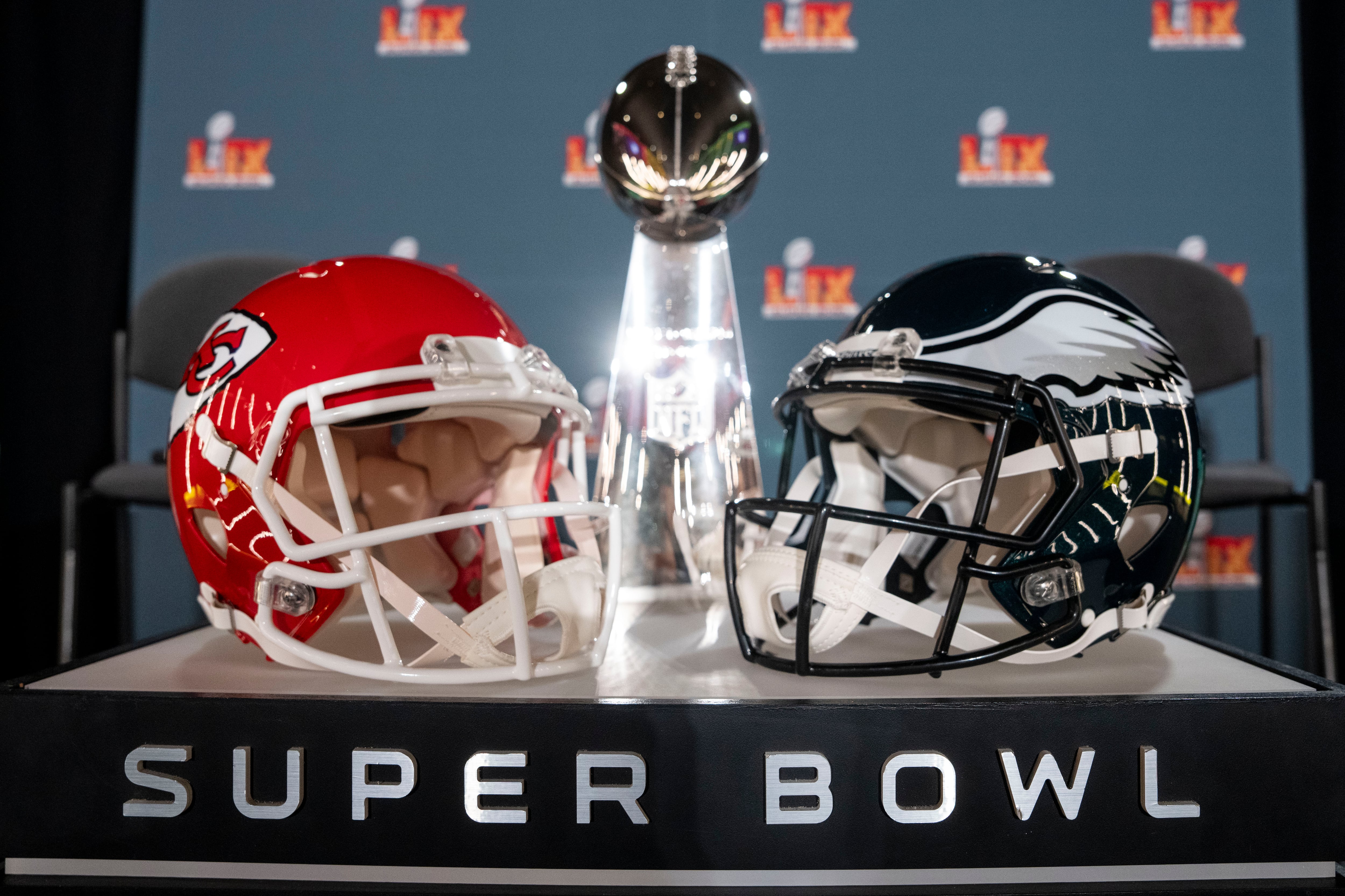 NEW ORLEANS, LOUISIANA - FEBRUARY 03: A detail shot of the Lombardi Trophy next to Kansas City Chiefs and Philadelphia Eagles helmets prior to a news conference on February 03, 2025 in New Orleans, Louisiana ahead of the NFL Super Bowl LIX football game between the Philadelphia Eagles and the Kansas City Chiefs. (Photo by Michael Owens/Getty Images)