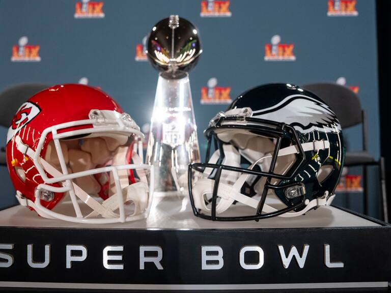 NEW ORLEANS, LOUISIANA - FEBRUARY 03: A detail shot of the Lombardi Trophy next to Kansas City Chiefs and Philadelphia Eagles helmets prior to a news conference on February 03, 2025 in New Orleans, Louisiana ahead of the NFL Super Bowl LIX football game between the Philadelphia Eagles and the Kansas City Chiefs. (Photo by Michael Owens/Getty Images)