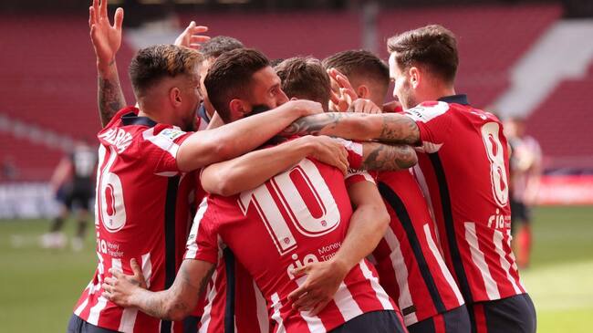 MADRID, SPAIN - APRIL 18: Marcos Llorente (2ndR) celebrates scoring their fourth goal with teammates Saul Niguez (R), Angel Martin Correa (3dL), Koke (2ndL) and Hector Herrera (L) during the La Liga Santander match between Atletico de Madrid and SD Eibar at Estadio Wanda Metropolitano on April 18, 2021 in Madrid, Spain. Sporting stadiums around Spain remain under strict restrictions due to the Coronavirus Pandemic as Government social distancing laws prohibit fans inside venues resulting in games being played behind closed doors. (Photo by Gonzalo Arroyo Moreno/Getty Images)