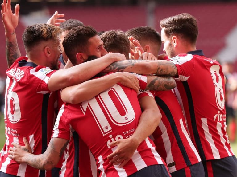 MADRID, SPAIN - APRIL 18: Marcos Llorente (2ndR) celebrates scoring their fourth goal with teammates Saul Niguez (R), Angel Martin Correa (3dL), Koke (2ndL) and Hector Herrera (L) during the La Liga Santander match between Atletico de Madrid and SD Eibar at Estadio Wanda Metropolitano on April 18, 2021 in Madrid, Spain. Sporting stadiums around Spain remain under strict restrictions due to the Coronavirus Pandemic as Government social distancing laws prohibit fans inside venues resulting in games being played behind closed doors. (Photo by Gonzalo Arroyo Moreno/Getty Images)