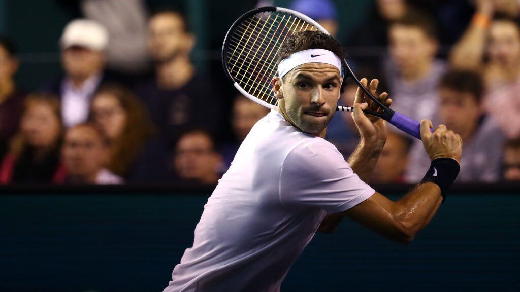 PARIS, FRANCE - OCTOBER 30: Grigor Dimitrov of Bulgaria returns a backhand in his match against David Goffin of Belgium on day 3 of the Rolex Paris Masters, part of the ATP World Tour Masters 1000 held at the at AccorHotels Arena on October 30, 2019 in Paris, France. (Photo by Dean Mouhtaropoulos/Getty Images)