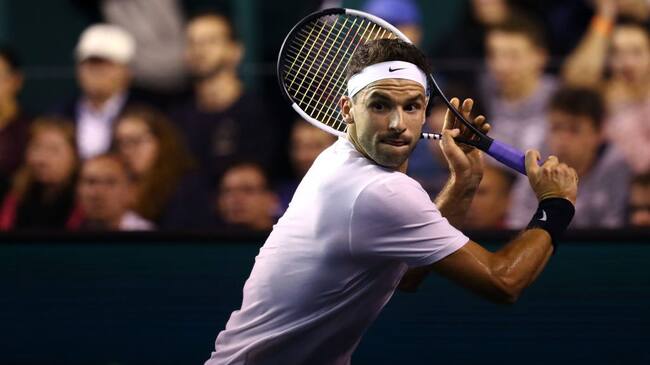 PARIS, FRANCE - OCTOBER 30: Grigor Dimitrov of Bulgaria returns a backhand in his match against David Goffin of Belgium on day 3 of the Rolex Paris Masters, part of the ATP World Tour Masters 1000 held at the at AccorHotels Arena on October 30, 2019 in Paris, France. (Photo by Dean Mouhtaropoulos/Getty Images)