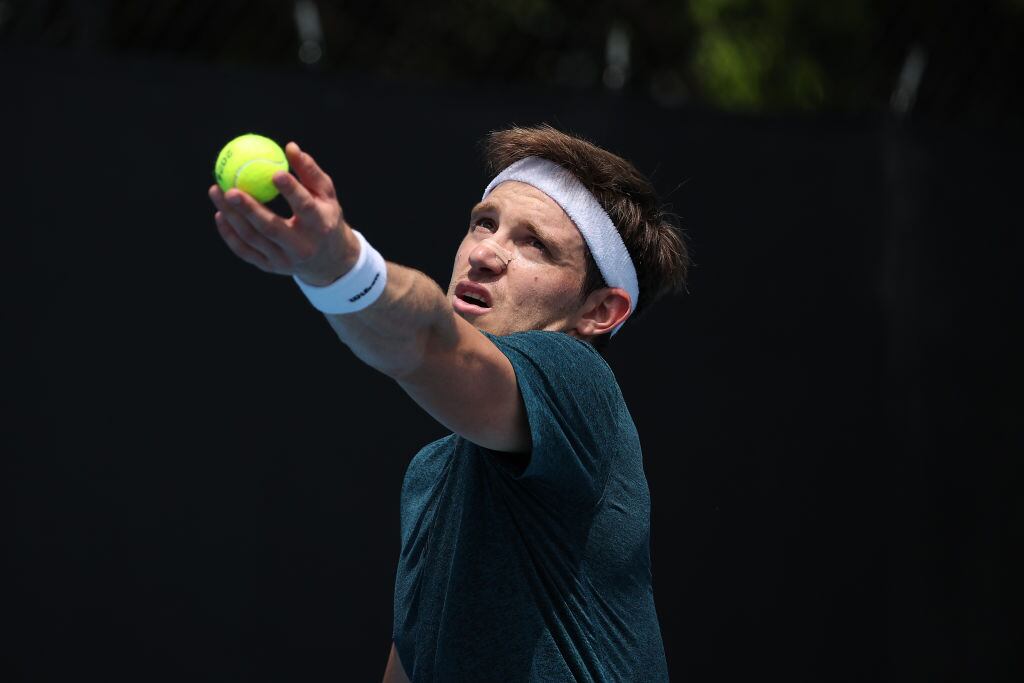 MELBOURNE, AUSTRALIA - JANUARY 15: Nicolas Jarry of Chile serves in their round one singles match against Flavio Cobolli of Italy during the 2024 Australian Open at Melbourne Park on January 15, 2024 in Melbourne, Australia. (Photo by Daniel Pockett/Getty Images)