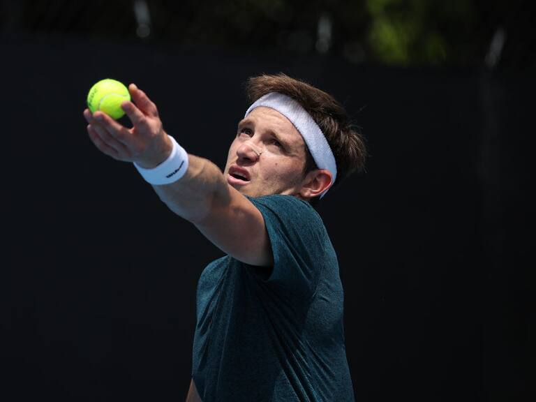 MELBOURNE, AUSTRALIA - JANUARY 15: Nicolas Jarry of Chile serves in their round one singles match against Flavio Cobolli of Italy during the 2024 Australian Open at Melbourne Park on January 15, 2024 in Melbourne, Australia. (Photo by Daniel Pockett/Getty Images)